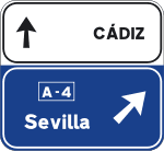 Advance direction sign towards a motorway or dual carriageway and continuing direction