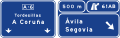 Advance direction sign on a motorway or dual carriageway for two very close exits towards any road and continuing direction