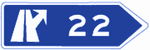 Immediate exit destination signs towards a motorway or dual carriageway